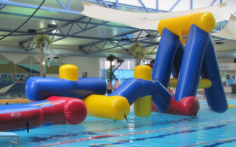 Inflatable obstacle course in a swimming pool at Gore Aquatic Centre
